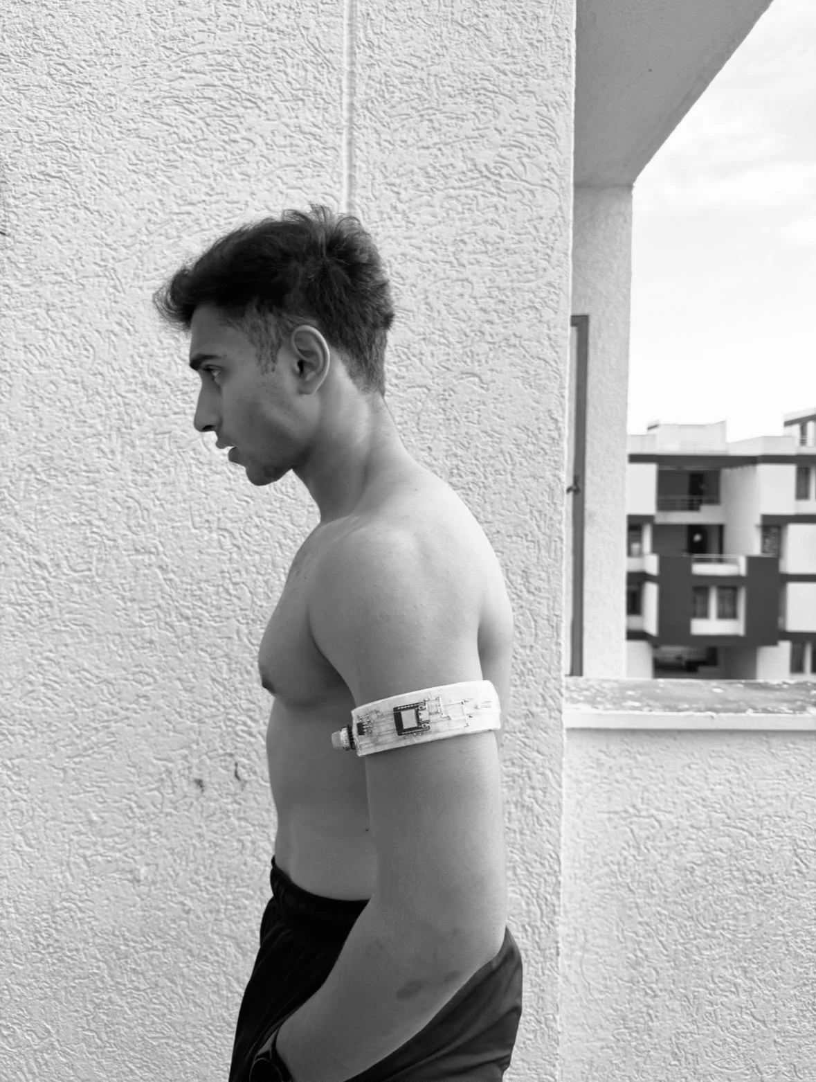 Ark Patil wearing the VION sweat-sensing band prototype he fabricated